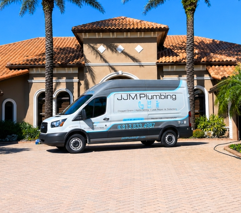 JJM Plumbing service van outside an Odessa home